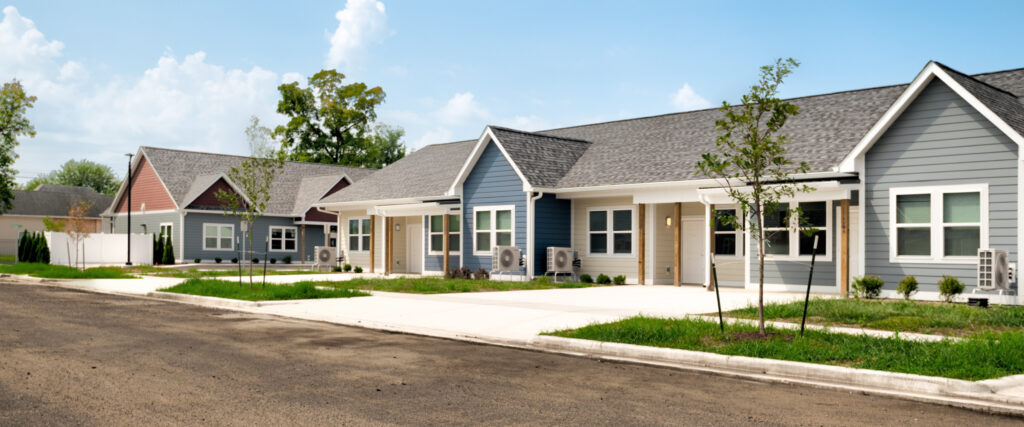 Image of River Valley Apartments in foreground and leasing office in background